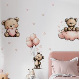Pastel pink toddlers' bedroom with teddy bear wall decals, pink bedding, and a white nightstand.
